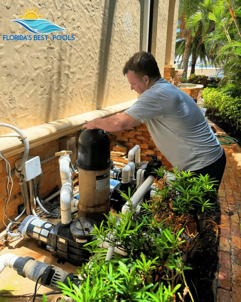 Technician inspecting pool equipment